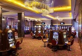 Filipino player browsing the 62ph game lobby on a mobile phone with slots and live casino options